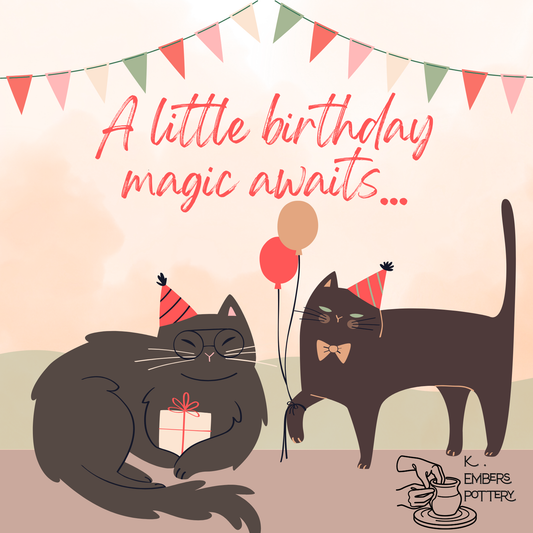 Illustration of two cats with party hats and balloons, celebrating a birthday, with text 'A little birthday magic awaits' and 'K. Embers Pottery' branding.