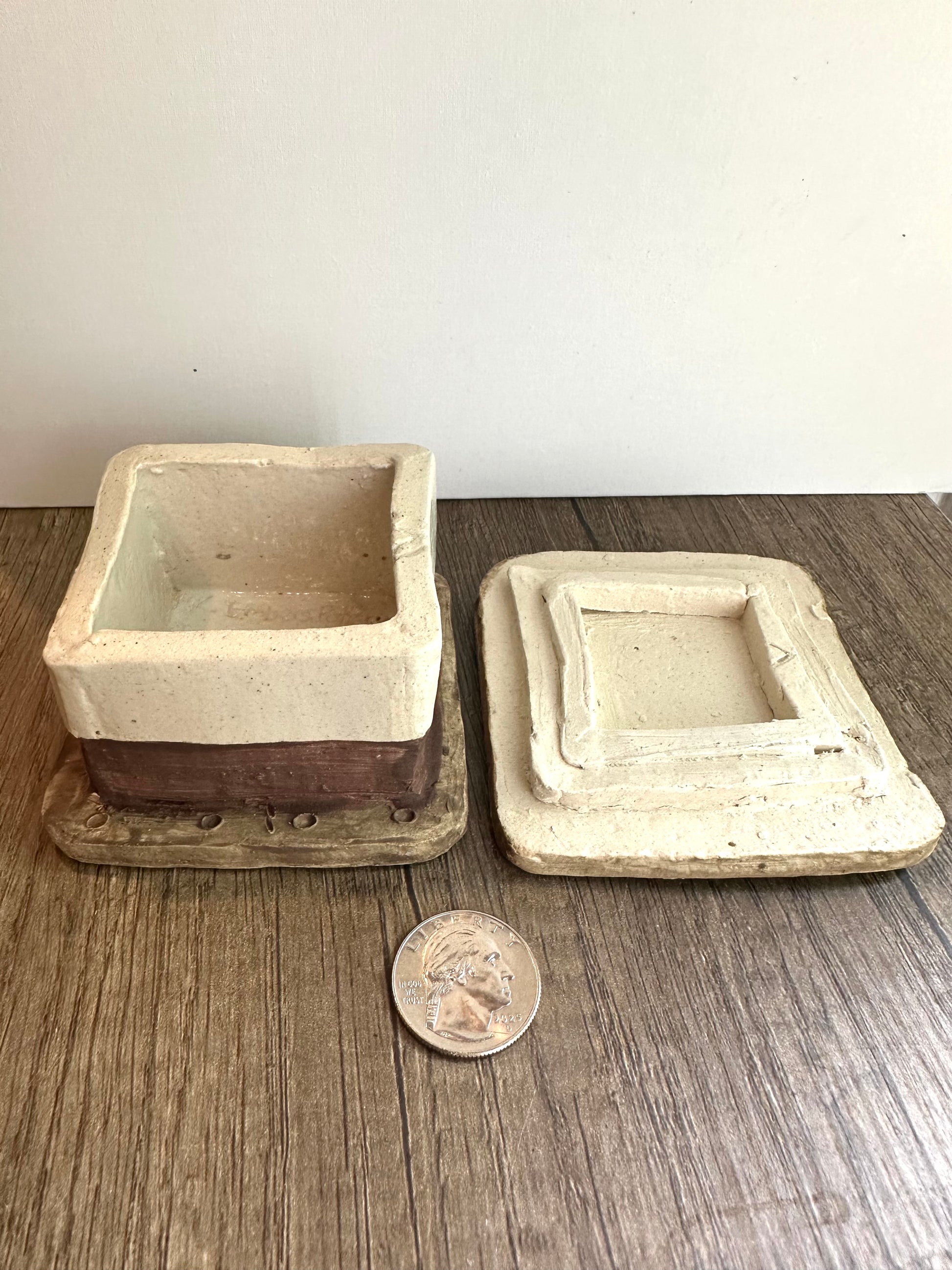 Smores-themed box with lid removed and placed aside, with coin for size reference.