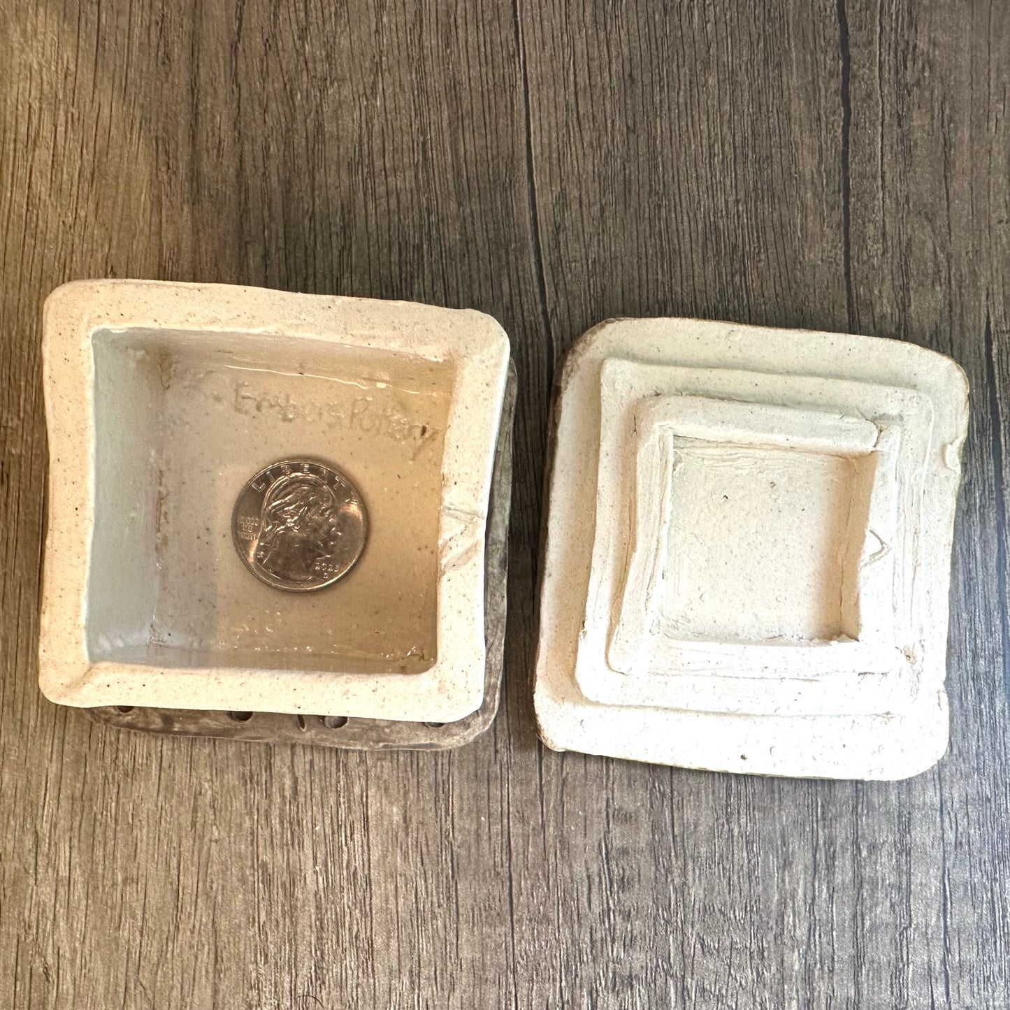 Overhead ishot of inside the smores-themed box with lid removed and placed aside, with coin inside body of box for size reference.